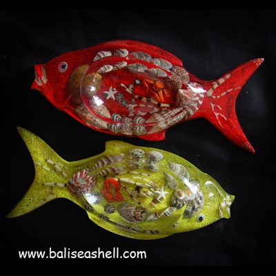 shell disc art with fish ornament