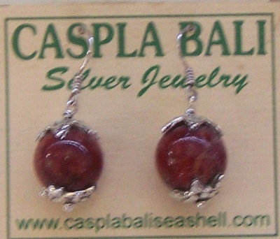 silver earing with coral round